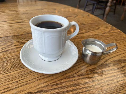 Coffee cup on a dish was a nice touch, as was the fresh creamer.