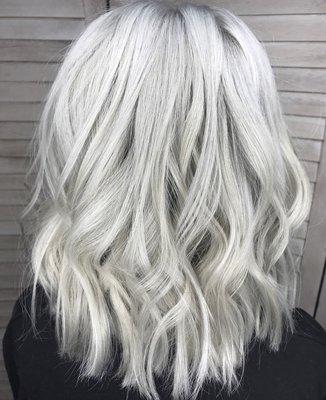 Platinum blonde bob and 1 row of natural beaded row extensions to fill in sparse areas. By Tiffany