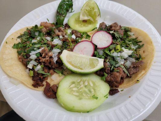 Carne asada and suadero taco