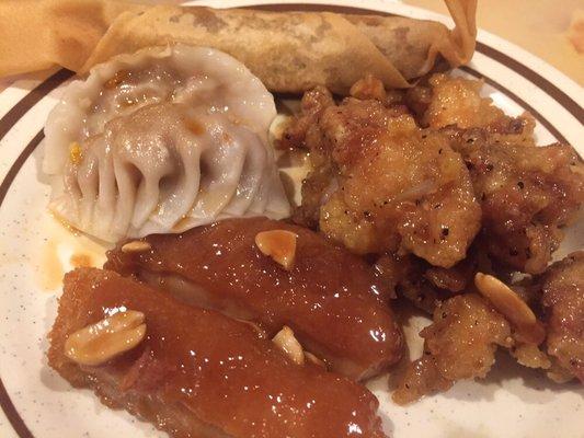 Clockwise from top: Home style roll, black pepper chicken, peanut chicken, dumpling