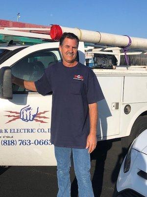 Here's our proud co-owner, Leland Mills smiling next to his truck.