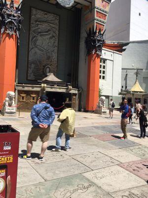 Front of Chinese theater with dim sum kiosk on right.