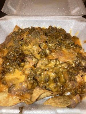 Nachos Regulares  With bean and cheese Choice of 1 meat: Asada, Bistek, Pastor, Chicken Fajita, or Beef Fajita  I picked Asada, very good!