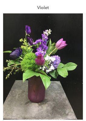 This is the photo of the "Violet" arrangement on The Flower Shop's website. The other image is how it looked as delivered.