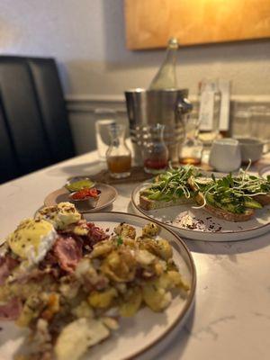 "Boring Bene" with pesto & micro greens on avocado toast, and of course, the seasonal mimosa flight.