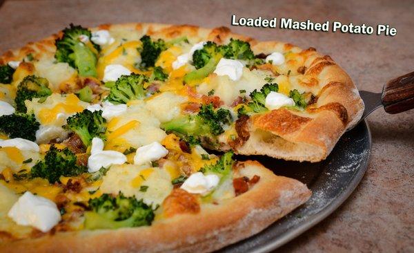 Loaded Mashed Potato Pie: white pie with bacon, broccoli, chives & sour cream topped with cheddar and mozz cheese.