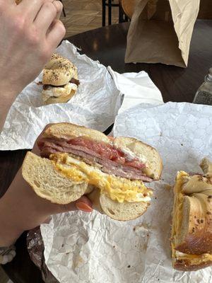 Pork egg and cheese bagel with tomato