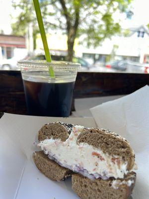 Whole Wheat Everything with lox spread and red onion plus an iced coffee