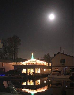 Full moon and decorated floating home