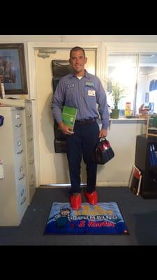 What our professional plumber's look like when they come to your home; complete with ID badge & shoe covers