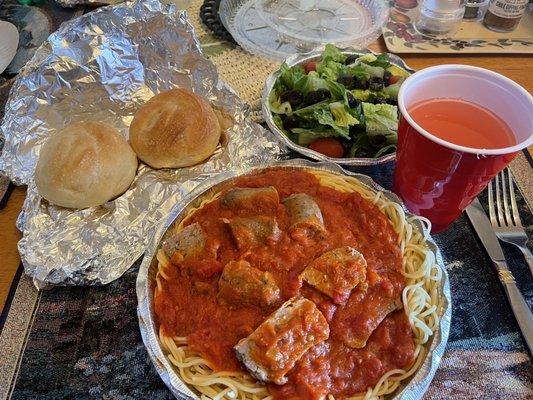 Spaghetti meal with additional sausages, rolls and salad!