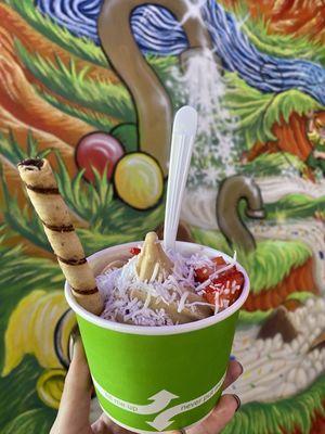 Mocha and raspberry with coconut, strawberries, and cookie straw