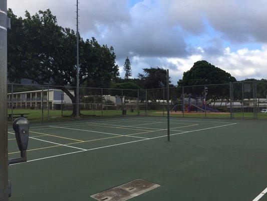 Volleyball court. No net up, but seems to have timer for lights at night.