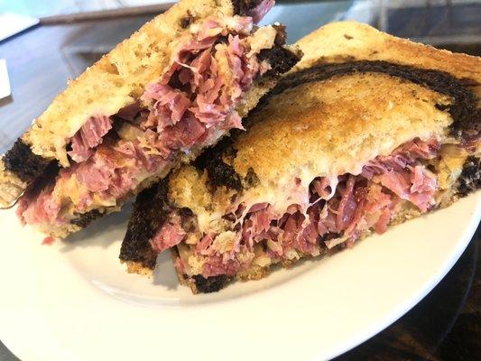 Corned Beef Reuben with sauerkraut on marbles rye bread.