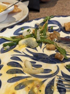 Piles of sliced jalepenos in egg dish. None were chopped or in small enough pieces to eat.