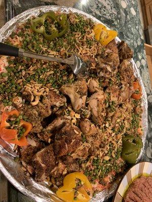 Rainbow Rice, 3 whole chicken cut pieces w/ skin topped with nuts, peas and colored peppers