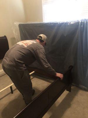 Co-owner Trevor Fulgham putting together a bed for a customer!