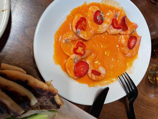 Poached Shrimp with strawberries, cherry tomatoes, and a Calabrian Chile Vinaigrette.