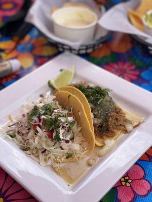 One fish taco & one carnitas taco