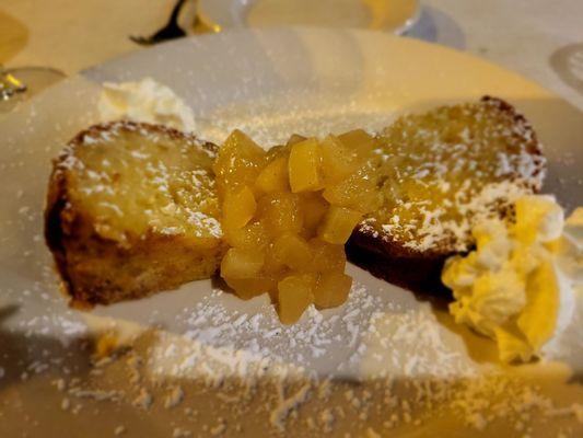 Torta di mele e olio d'olive: Apple olive oil pound cake topped with whipped cream & seasonal