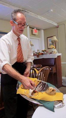 Our waiter Chris showing off the yummy desserts.