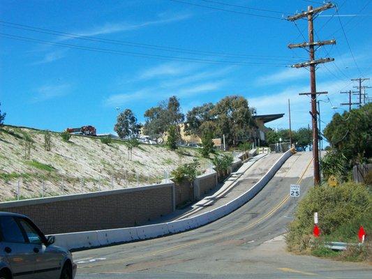 Concrete barriers separate traffic from the construction work.