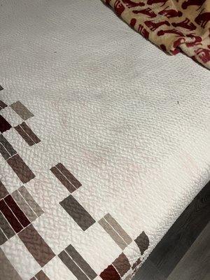 Stained bed spread