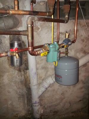 A rough install for a circulation pump with isolation flange valves new expansion tank..