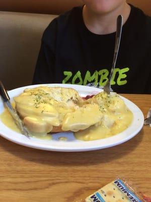 Radioactive looking roast turkey sandwich. Yellow gravy.