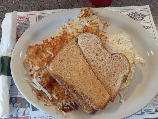 My hash browns, egg over easy, and wheat toast ala carte.