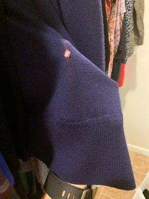 Brand new sweater, worn once. Returned with obvious hole.