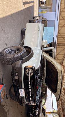 Ford Bronco windshield replacement with lane departure sensor and automatic rain sensor.