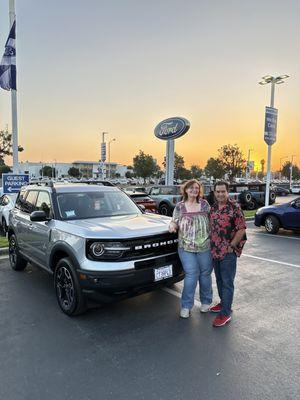 Me, hubby and our new Bronco Sport ready to take it home. Thank you Hazein!