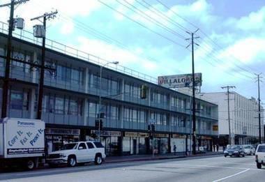 There is a parking lot for this building, entrance on Santa Monica Blvd