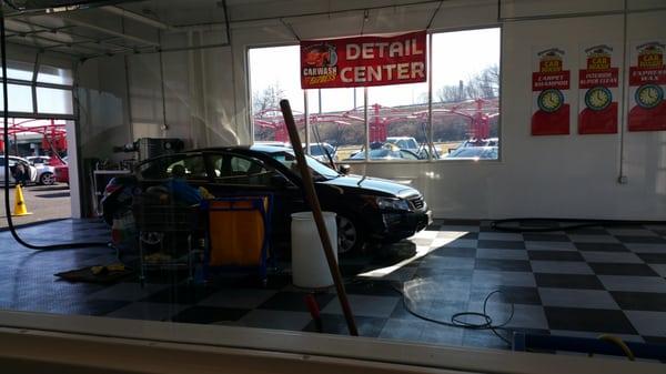 My car getting carpets shampooed in express detail bay.