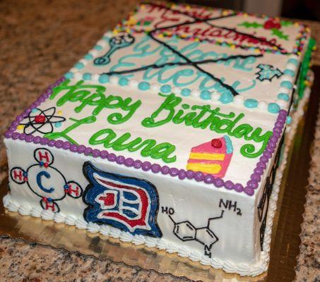 Custom triple event sheet cake with Duke logo and chemical symbols.