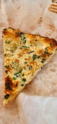 One slice of garlic naan to spice up your life!