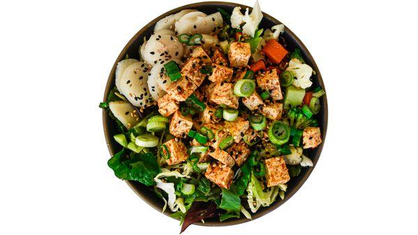 Tofu Greens Bowl with green onions, toasted sesame seeds, steamed vegetables, and sliced water chestnuts