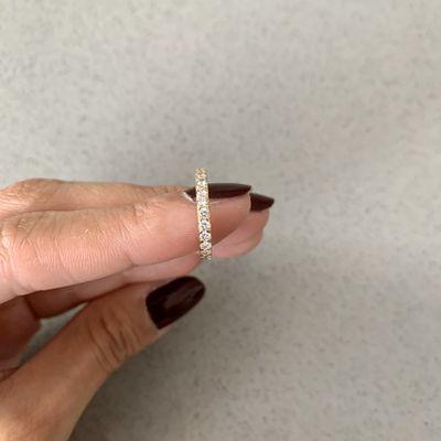 Thin gold, diamond wedding band.