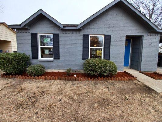 Fixed brick mortar joints in wall painted exterior of house.and did the landscape