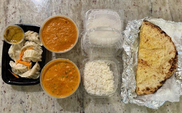 Chicken momos, Lamb Tikka Masala, Matar Paneer, Garlic Cheese Naan