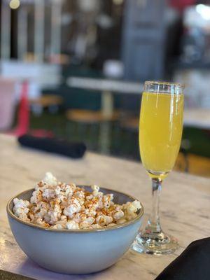 Complimentary Popcorn and Mimosa...duh!! It's brunch lol