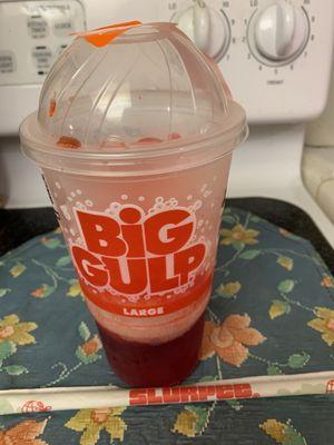 Slurpee Cherry 30oz with straw. My favorite drink!