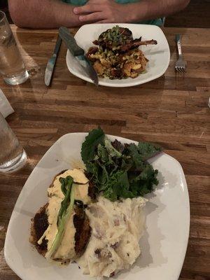 Crab Cakes stuffed w/Mac & Cheese and Asiago Mashed Potatoes. Across from me is the Pork Chop w/succotash.