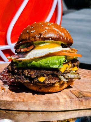 All-Star - two smashed patties, american cheese, iceberg lettuce, tomato, house onion, pickles, dunk sauce served on buttered sesame bun+egg