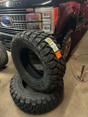 Tires being installed on the 250 in photo