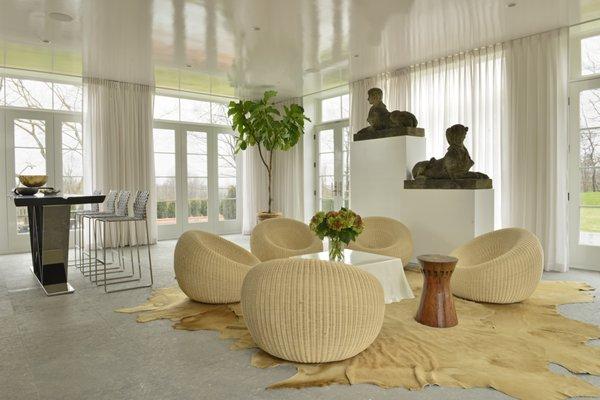 Solarium with Mid-Century Modern Rattan Seating in Old Westbury Long Island