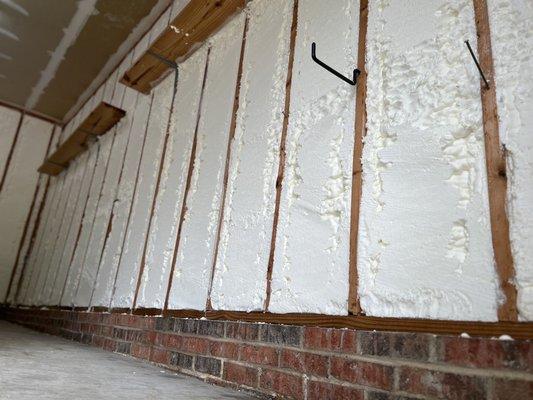 Picture of garage wall with spray foam... will Be sheet-rocking over so I can hang tools back up.