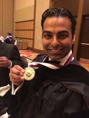 Dr. Patel being awarded the Diplomate Medallion for the American Board of Oral Implantology/Implant Dentistry