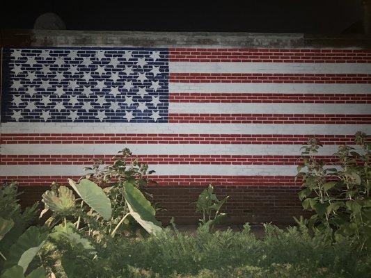 Exterior of the building with a painted American Flag